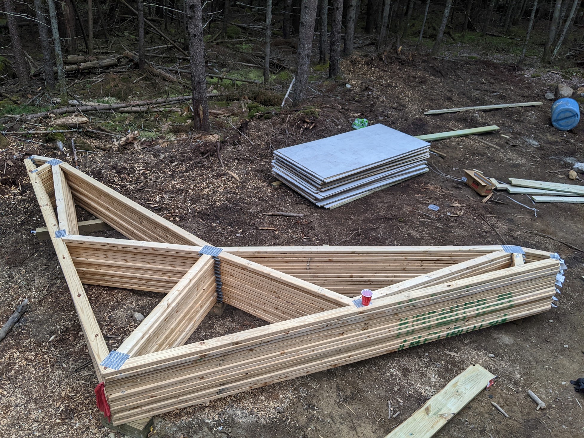 Trusses piled near the pavilion